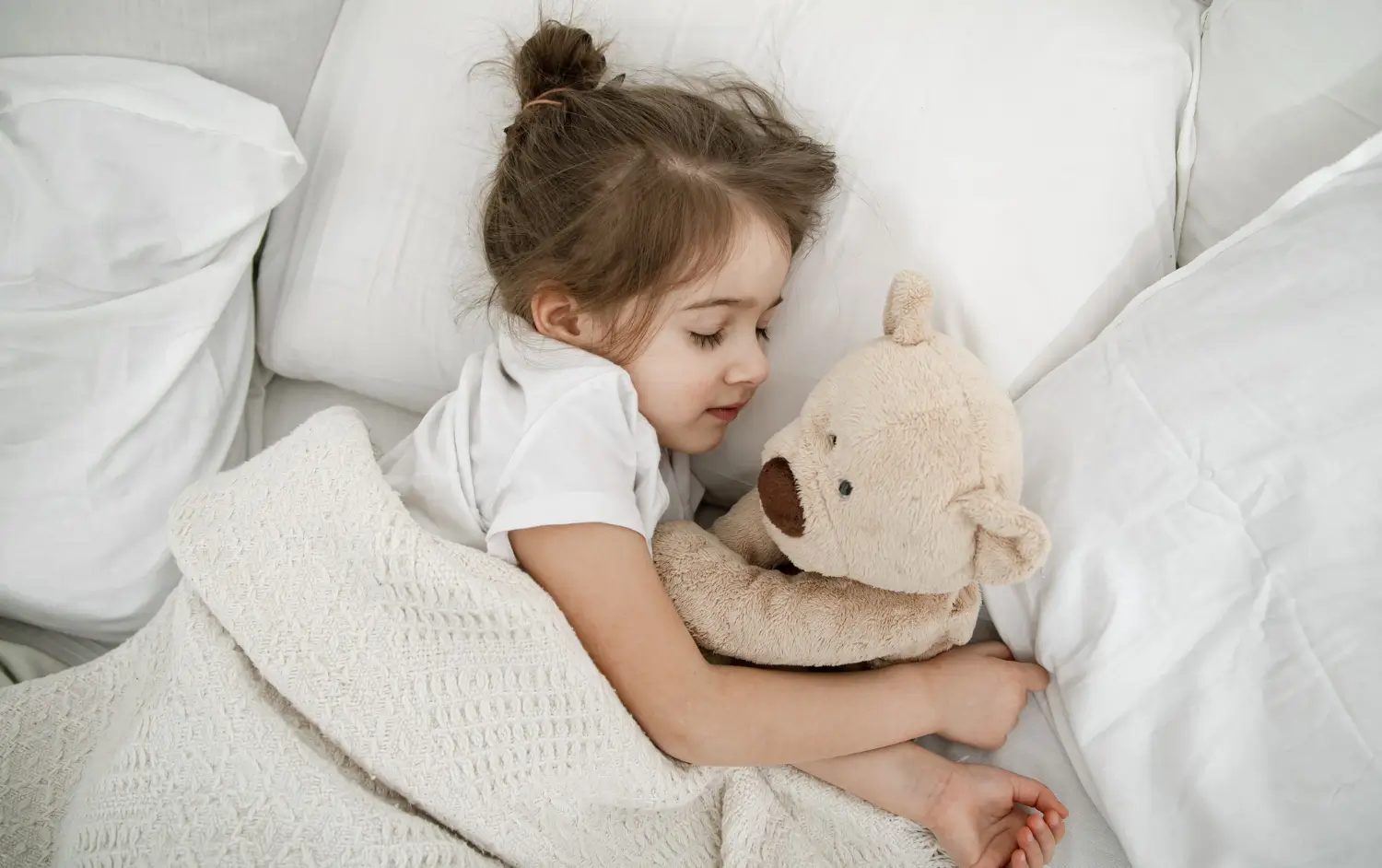 Child sleeping peacefully in bed