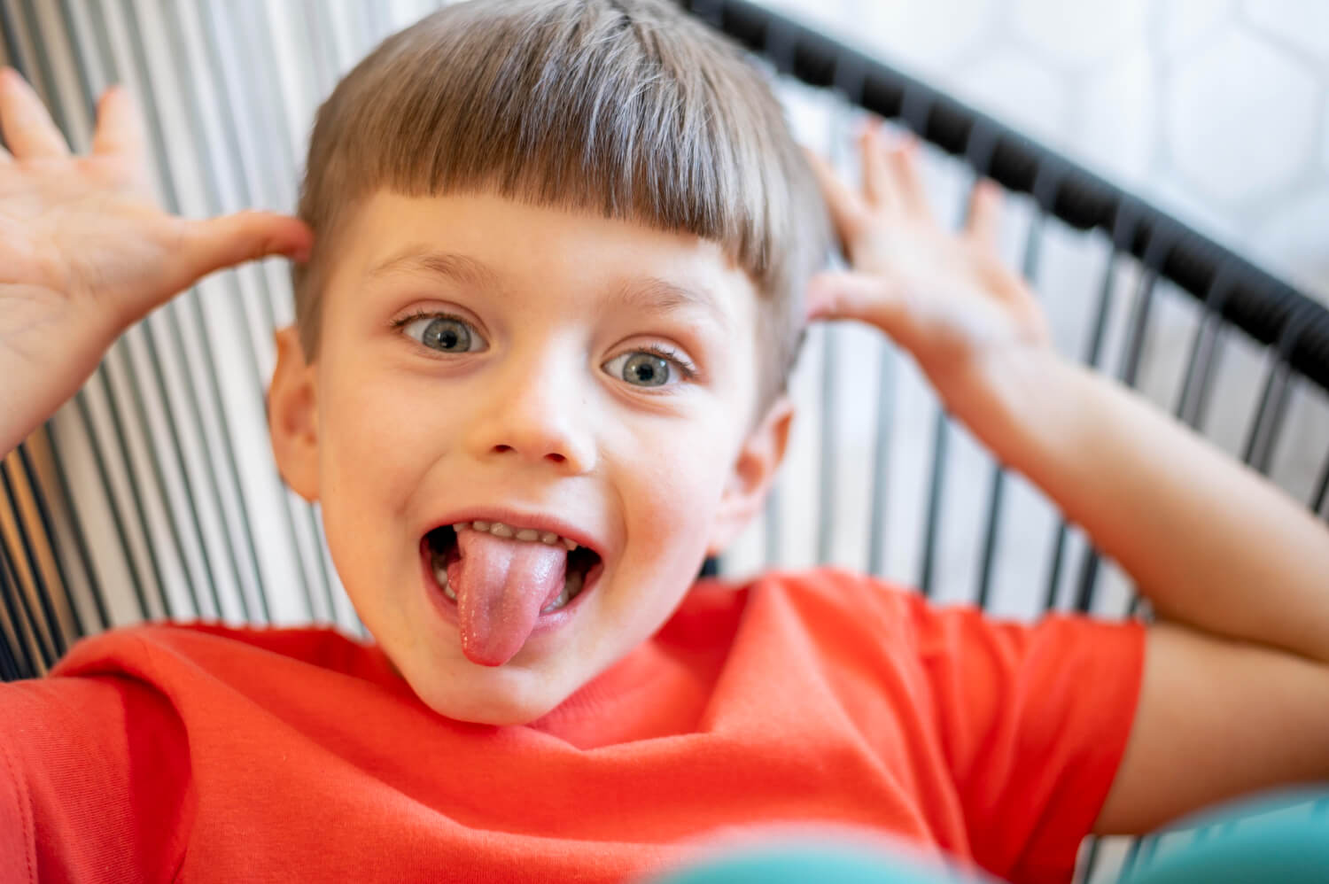 Child sticking tongue out playfully
