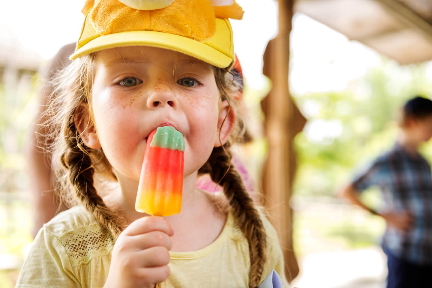 Younggirl eating ice cream a young girl eating a popsicle after tonsillectomy surgery